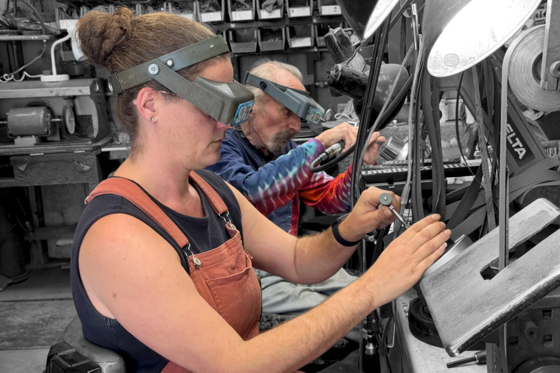 Robert Beard and Daniëlle Roossien working at their workshop workbench.
